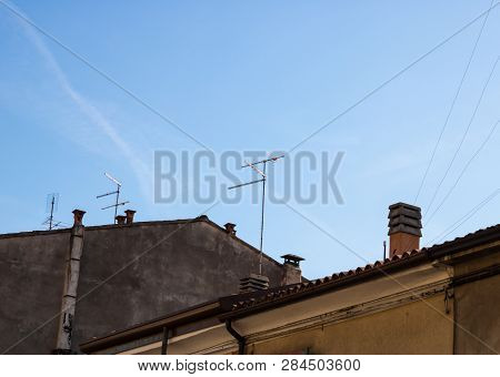 Television Antennas With The Old Roofs View