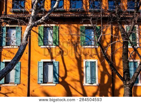 Windows Of The Orange Building - Architecture Detail In Verona, Italy