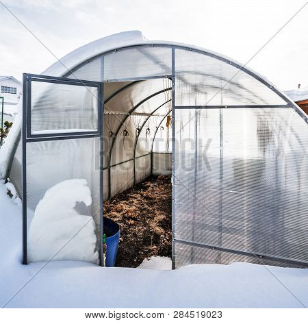 Snow-swept Greenhouse Made Of Polycarbonate In The Country. Berdsk, Novosibirsk Region, Western Sibe