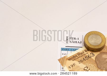 Indian Individual Income Tax Form Itr-1 With Indian Coins On Isolated Background.