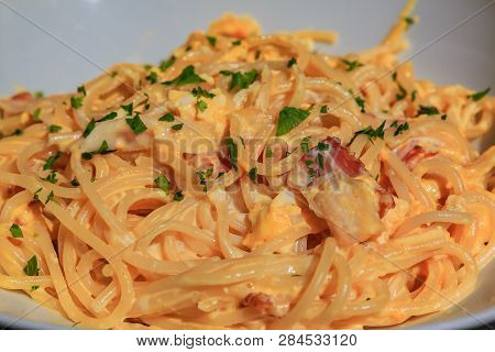 Close Up View Of A Plate Of Delicious Freshly Made Italian Spaghetti Carbonara With Ham, Eggs And Pa