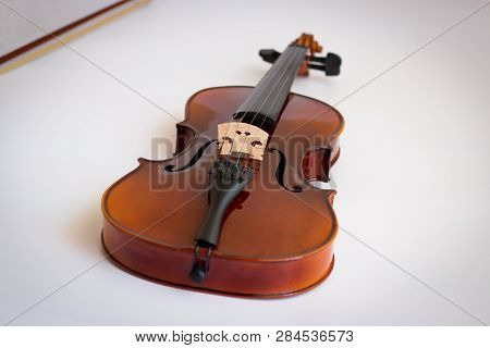 Violin Or Viola With Bow In White Background. Fiddle In White Background