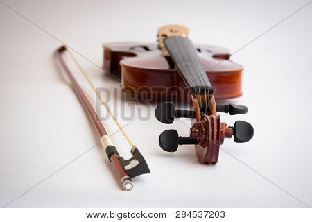 Violin with bow in white background or fiddle in white background