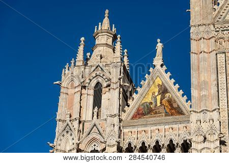 Detail Of The Facade Of The Siena Cathedral, Santa Maria Assunta 1220-1370 With The Coronation Mosai