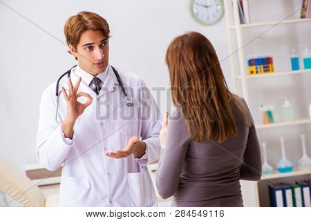 Deaf-mute female patient visiting young male doctor