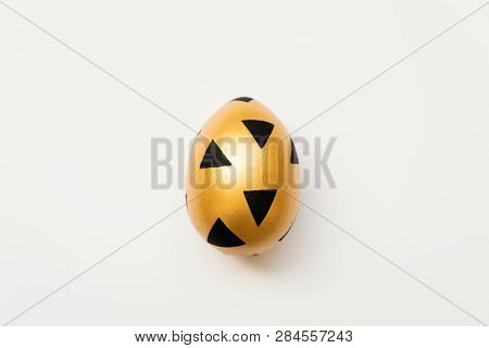 Easter Decorated With Golden Potal Egg  Isolated On White Background. Minimal Easter Concept. Top Vi