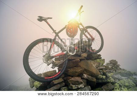 Bike In The Fog At Sunrise