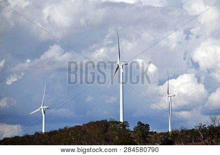 Wind Turbines Under A Dramatic Cloudy Sky Between Goulburn And Yass In Rural New South Wales, Austra