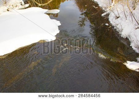 Beautiful Forest River In Winter Shores In The Snow Trees Are Reflected In The Water