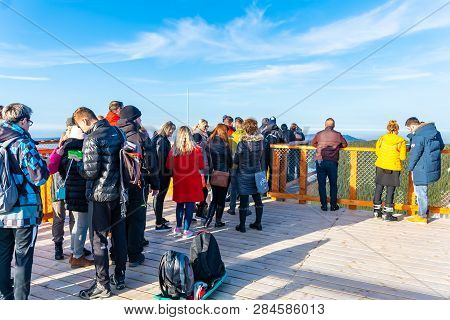 Pustevny, Czech Republic, February 16, 2019: Undefined Tourists Watching Nature And Walking On A New