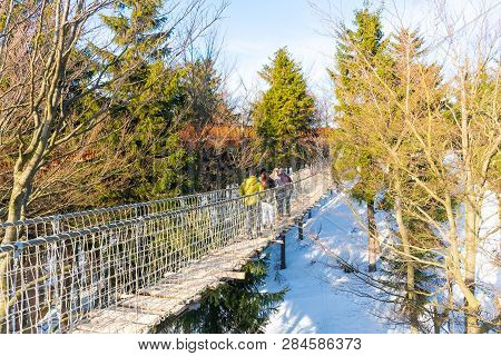 Pustevny, Czech Republic, February 16, 2019: Undefined Tourists Watching Nature And Walking On A New