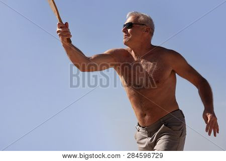 Portrait Of A Man Playing Beach Tennis