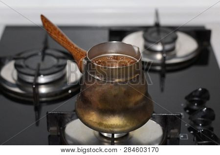 Coffee Is Prepared In The Turka, Coffee Pot, Coffee Maker, At Home. It Boils, Foam Appears. Turka Fo