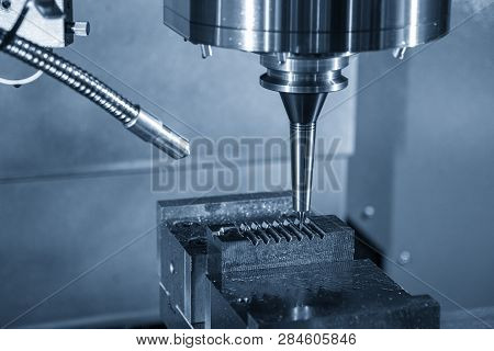 The  Cnc Milling Machine Cutting The Mould Part With The Solid Ball End Mill Tool.the Hi-technology 