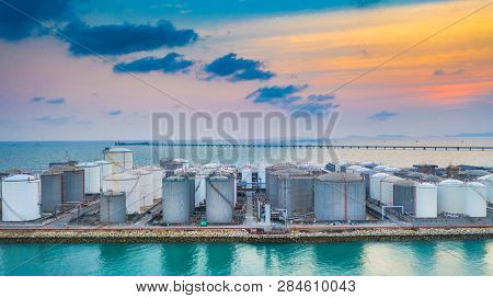 Storage Of Liquid Chemical And Petrochemical Products Tank, Aerial View At Sunset.