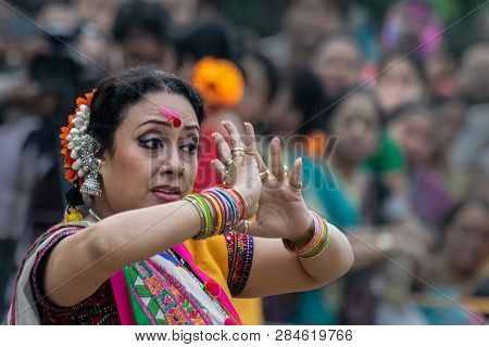 Kolkata , India - March 1, 2018: Expression Of Woman Dancer, Dressed In Traditional Indian Sari And 