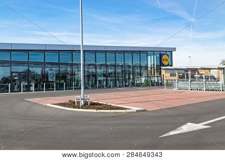 Mouscron,belgium-february 17,2019: View Of Lidl Supermarket And Logo.lidl Stiftung & Co. Kg  Is A Ge