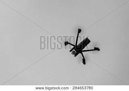 Drone Aka Unmanned Airborne Vehicle Taking Aerial Pictures In Black And White