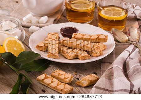 Puff Pastry Cookies With Jam On White Dish.