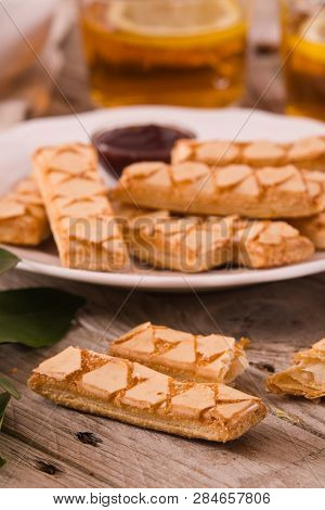 Puff Pastry Cookies With Jam On White Dish.