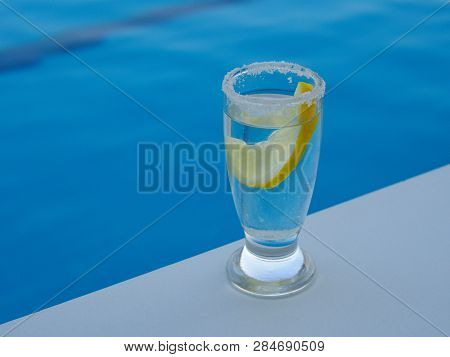 Fresh Lemon And Salted Tequila Shot By The Pool