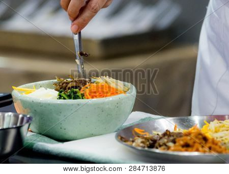 Bibimbap, Traditional Korean Cuisine Bibimbap, Chef Preparing Korean Food, Chef Cooking In Kitchen