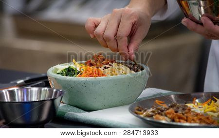 Bibimbap, Traditional Korean Cuisine Bibimbap, Chef Preparing Korean Food, Chef Cooking In Kitchen
