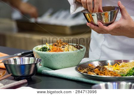 Bibimbap, Traditional Korean Cuisine Bibimbap, Chef Preparing Korean Food, Chef Cooking In Kitchen
