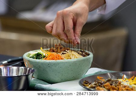 Bibimbap, Traditional Korean Cuisine Bibimbap, Chef Preparing Korean Food, Chef Cooking In Kitchen