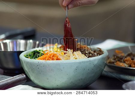 Bibimbap, Traditional Korean Cuisine Bibimbap, Chef Preparing Korean Food, Chef Cooking In Kitchen