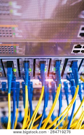 fiber network cable connecting on network core switch close up