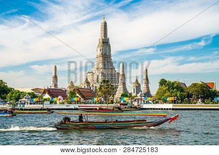 Temple Of Dawn Wat Arun With Boat Blue Sky Sunny Day