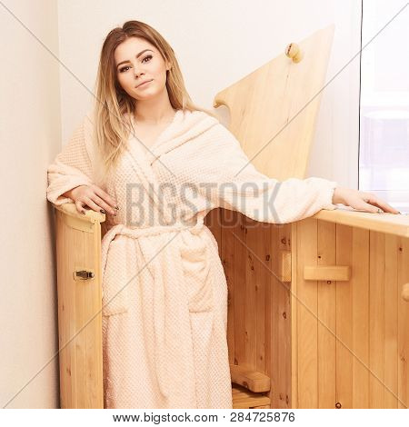 Barrel Cedar. Wellness Spa Sauna. Aromatherapy Treatment. Young Beauty Woman. Girl Face