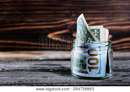 Saving Money In Jar With American Dollors , Cash