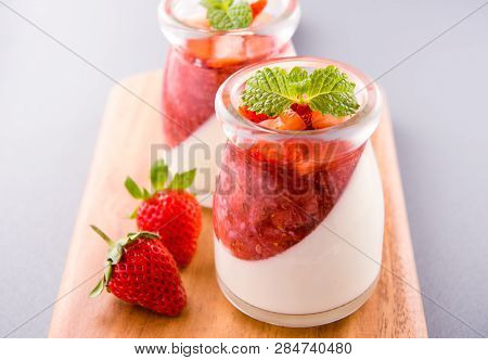 Delicous And Nutritious Double Color (colour) Strawberry Desserts With Mint And Diced Sarcocarp Topp