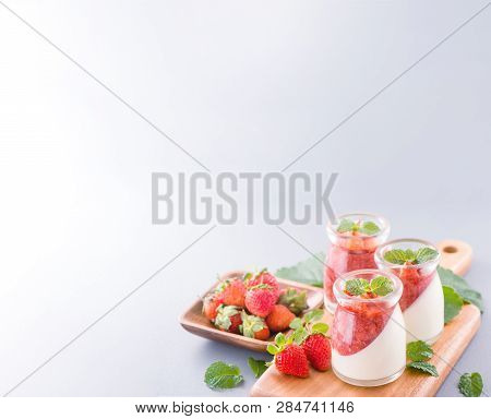 Delicous And Nutritious Double Color (colour) Strawberry Desserts With Mint And Diced Sarcocarp Topp