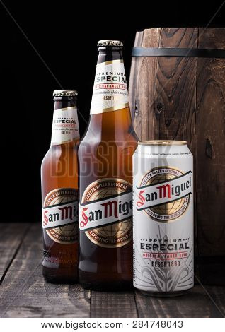 London, Uk - February 06, 2019: Glass Bottle And Aluminium Can Of San Miguel Lager Beer Next To Wood