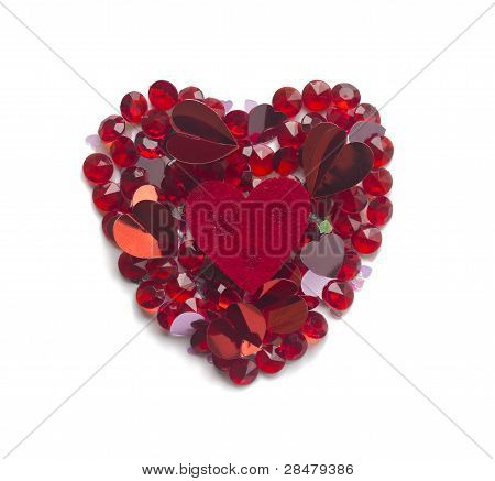 Shape Of Heart Made With Mix Of Confetti And Crystals,  Isolated On White Background..