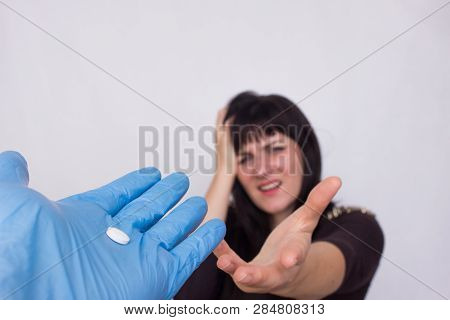 The Doctor Holds Out A Headache Pill For A Girl Who Has A Headache, The Concept Of Antispasmodics An