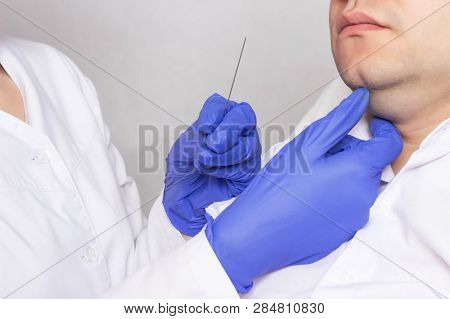 The Cosmetologist Does The Procedure For A Man To Reduce The Double Chin With The Help Of Mesothread