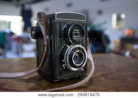 Vintage Twin Lens Camera On The Table.