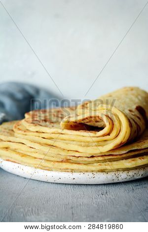 Norwegian Potato Pancakes Lefse On A Light Background With Cheese And Greens. Traditional Scandinavi