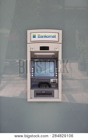 Vienna, Austria - July 12, 2015: Bankomat Atm At Bank Building Glass Wall In Vienna, Austria.