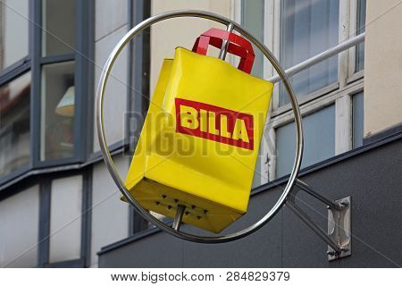 Vienna, Austria - July 12, 2015: Rotating Yellow Bag Sign Of Supermarket Billa In Vienna, Austria.