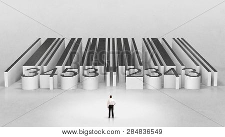Young businessman standing in front of a big codebar