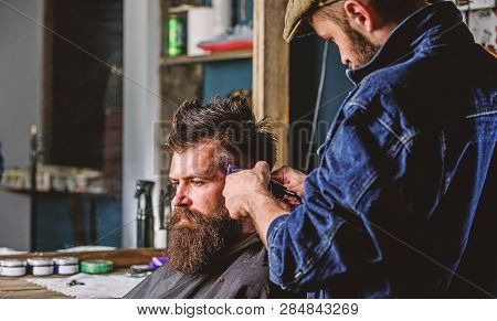 Barber With Clipper Trimming Hair On Temple Of Client. Hipster Client Getting Haircut. Hipster Lifes