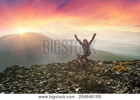 Alpine Landscape With A Biker