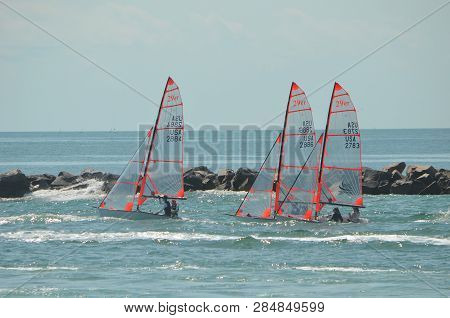 Olympic Sped Class Sailboats Being Towed To A Starting Position Of Biscayne,bay For A Midwinter Rega