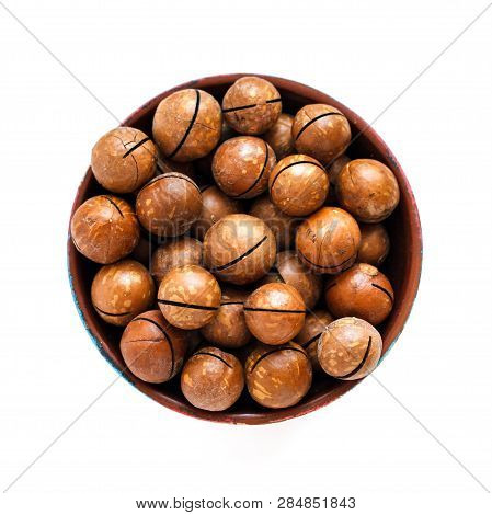 Macadamia Nuts In Bowl On White Background, Top View
