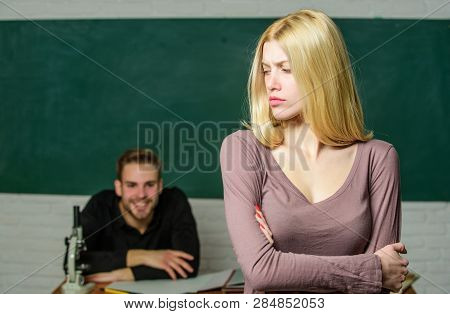 Taking An Exam. Female Student With Schoolmaster At Examination. Pretty Woman Standing Hands Crossed
